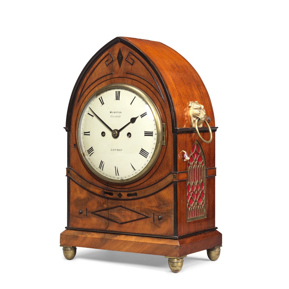 A early 19th century Regency Mahogany Lancet table Clock Webster, Cornhill, London: A early 19th century Regency Mahogany Lancet table Clock Webster, Cornhill, London The case with a lancet top with raised detailing to the front depicting geometric patterns and Regency designs, the