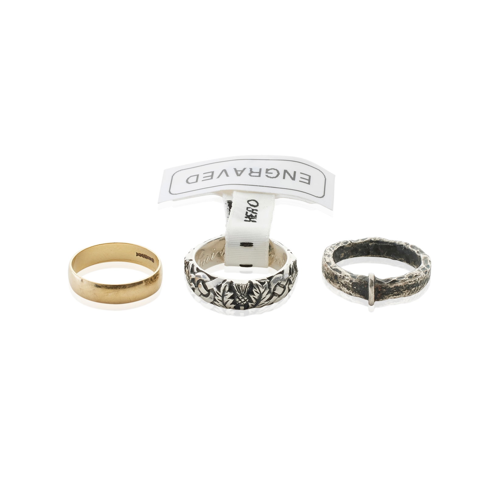 Claire's three wedding rings Various Seasons and Episodes 3: Claire's three wedding rings Various Seasons and Episodes Comprising: one gold coloured wedding band; a hammered metal band known as the 'Lallybroch' ring; and a silver coloured metal band engraved wi