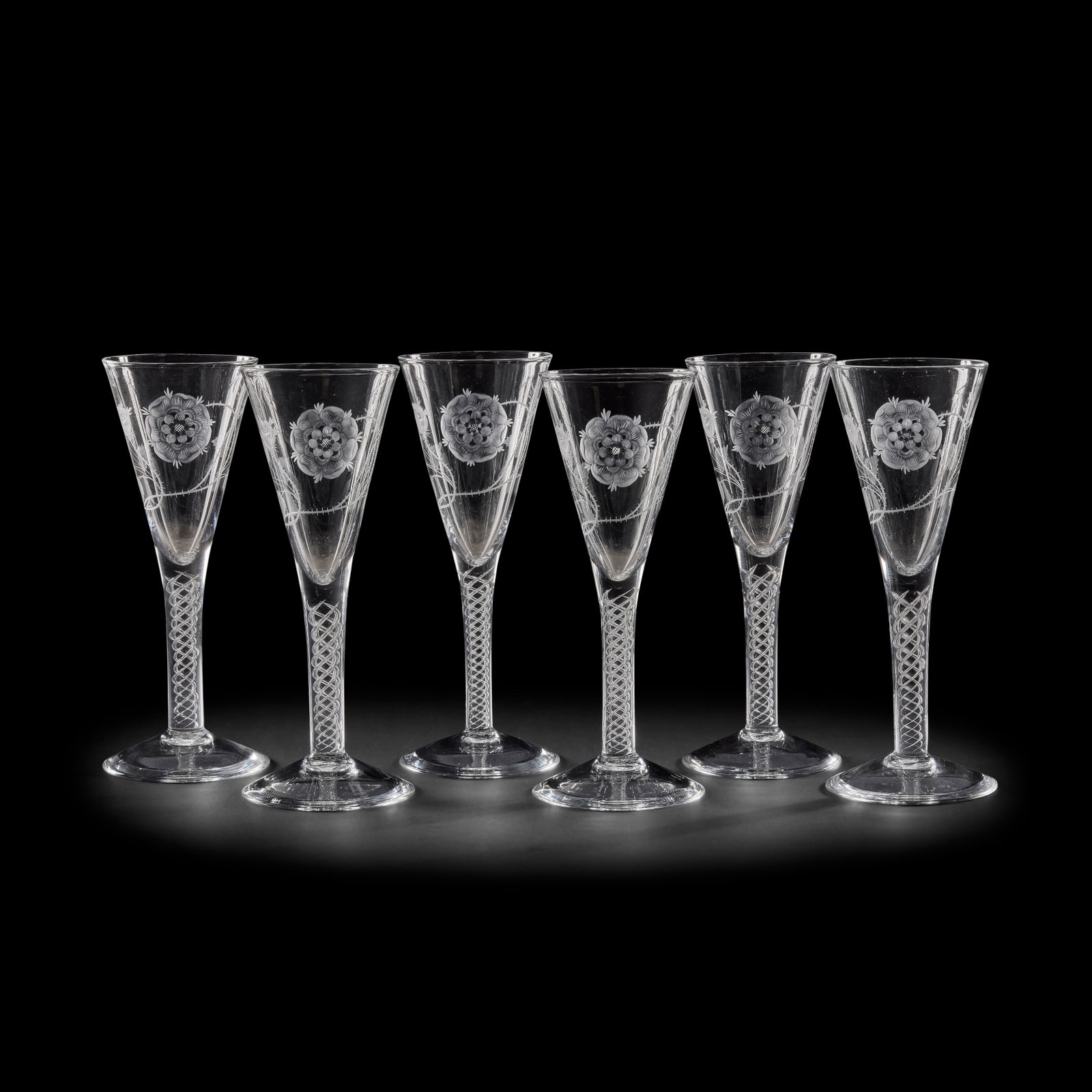 A matched set of six etched and air-twist clear glass wine goblets, in the 18th century Jacobite... (1 of 1)