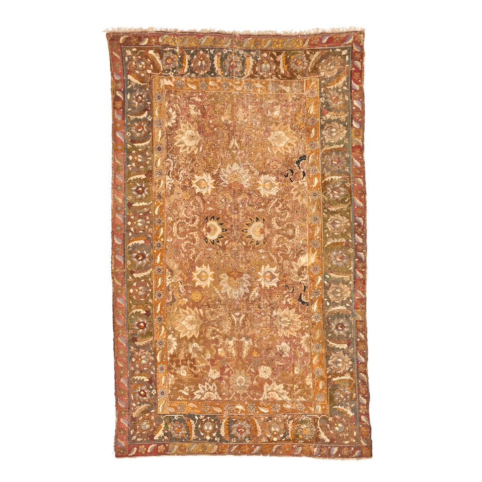 Mughal Carpet India 6 ft. 6 in. x 12 ft.: Mughal Carpet India c. 17th century, muted colors, the weave is coarser than usual and more akin to an Agra. Very old natural dyes including a cobalt blue, light purple, a lac maroon, and a honey butt