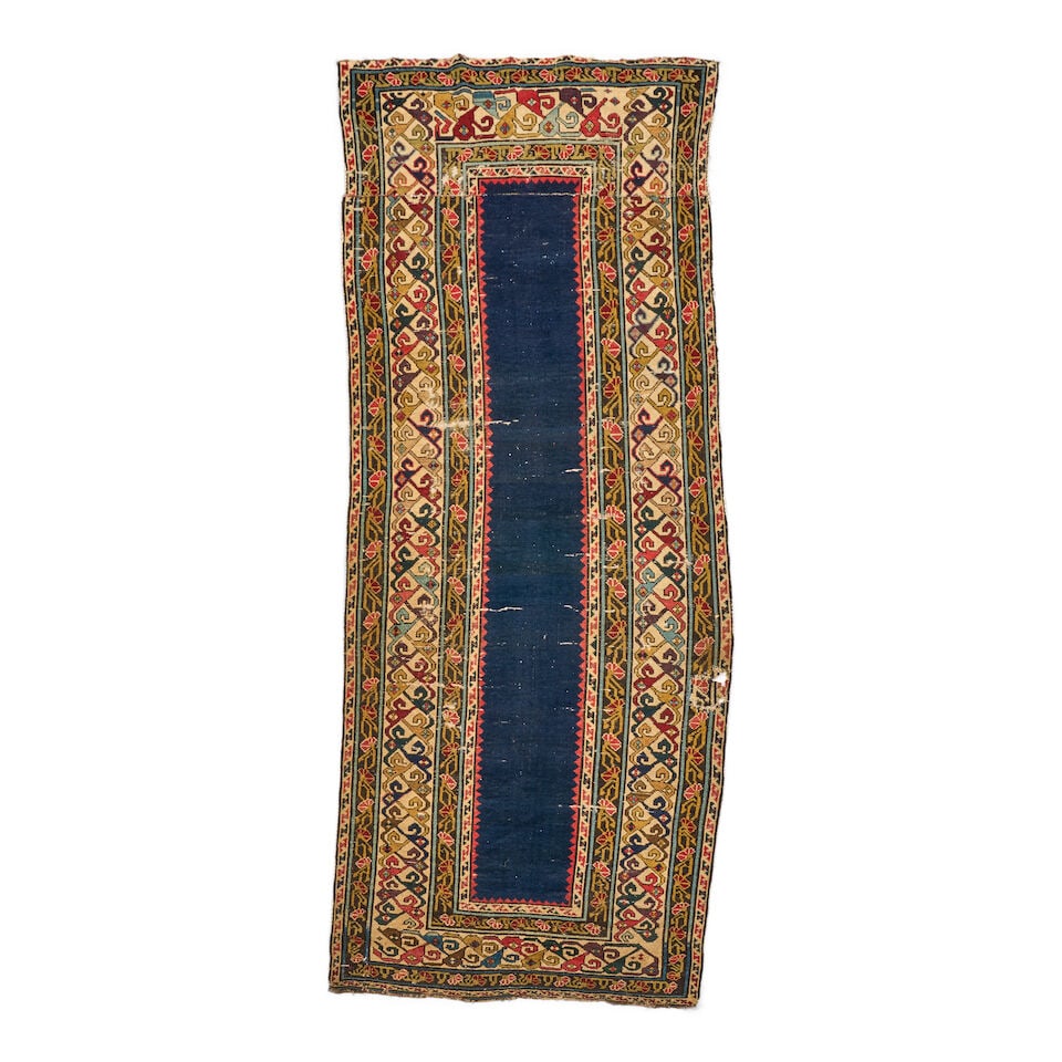 Early Shirvan Rug Caucasus 3 ft. 4 in. x 8 ft. 3 in.: Early Shirvan Rug Caucasus c. first half 19th century, a deep purple and duckbill green with natural tan tones and a nice old handle. 3 ft. 4 in. x 8 ft. 3 in. For further information on this lot