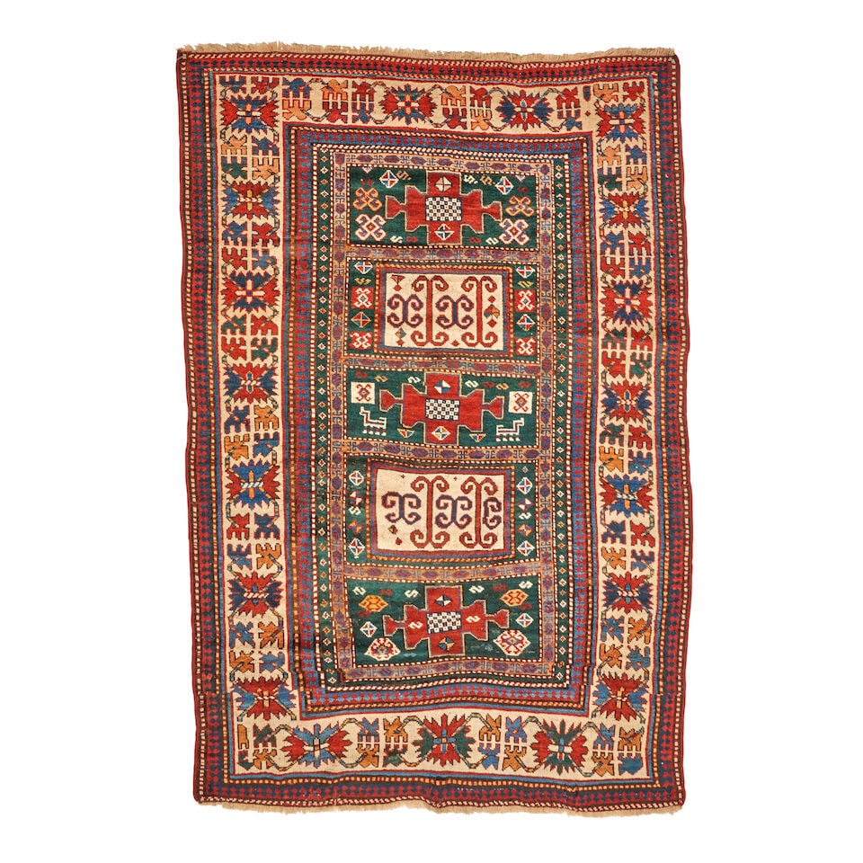 Kazak Rug Caucasus 4 ft. 5 in. x 7 ft.: Kazak Rug Caucasus c. fourth quarter 19th century, a deep forest green field, multiple tones of blue, and charming animals in the field. 4 ft. 5 in. x 7 ft. For further information on this lot please 