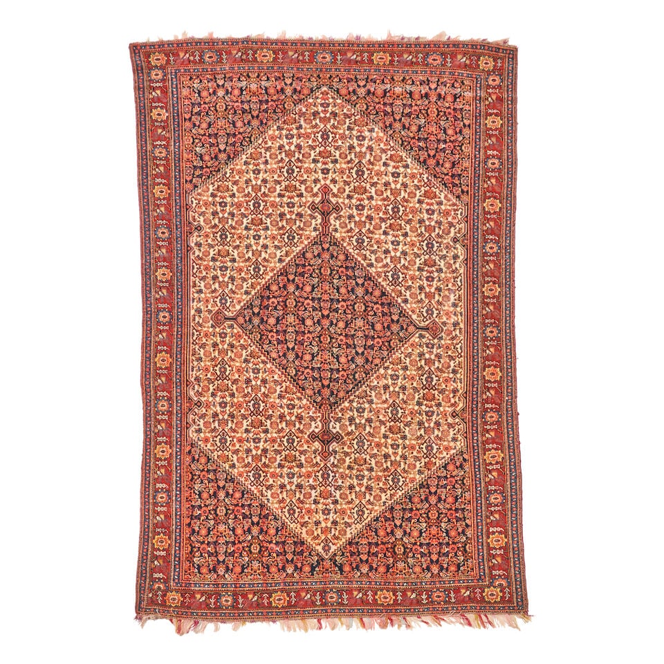 'Rainbow Silk' Senneh Rug 4 ft. 1 in. x 6 ft. 7 in.: 'Rainbow Silk' Senneh Rug c. 1900, with multicolored silk fringe, giving the rug a 'rainbow' appearance at the ends and on the back. **Saleroom Notice: Special Conditions on the sale of Iranian-origin