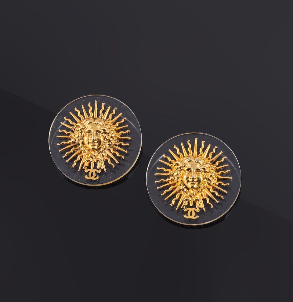 Chanel. Deux broches Roi Soleil en métal doré et PVC transparent. Chanel. Two Roi Sole... (1 of 1)