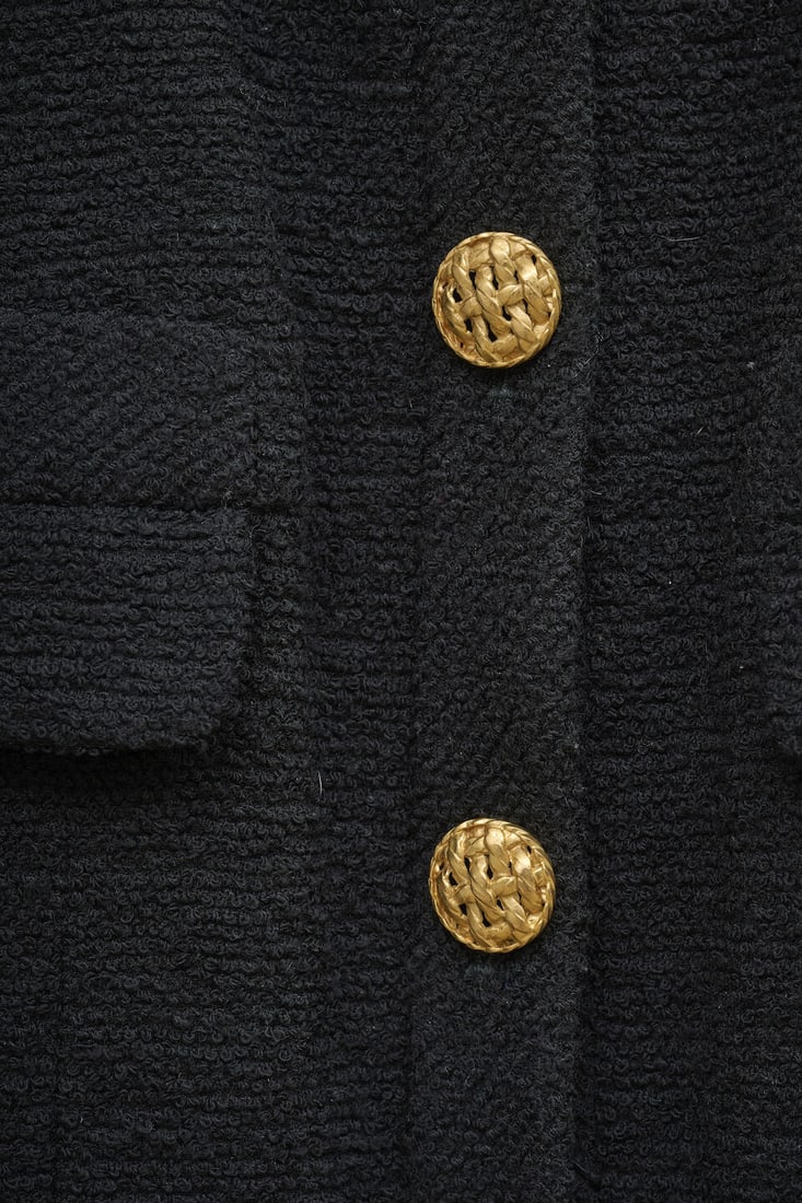 Chanel, années 1990. Veste longue en tweed noir à multiples poches. Chanel, 1990s. Lon... - 2