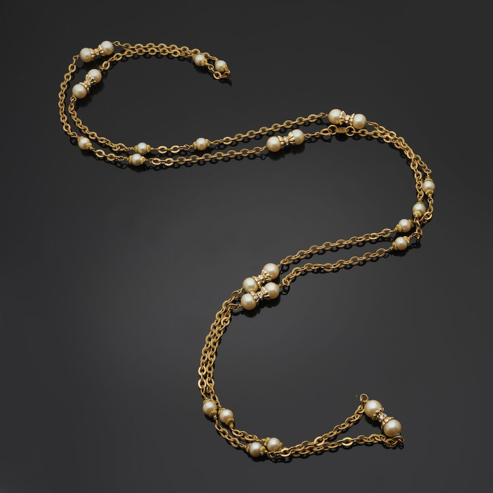 Chanel, circa 1983. Long sautoir chaine doré entrecoupé de perles blanches irisée... (1 of 2)