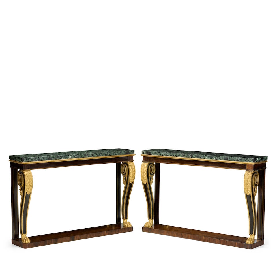 A pair of Regency rosewood, parcel gilt and brass line-inlaid console tables Circa 1820, with la...: A pair of Regency rosewood, parcel gilt and brass line-inlaid console tables Circa 1820, with later marble tops Each with a later verde antico marble top above an ovolo moulded cornice, over a plain