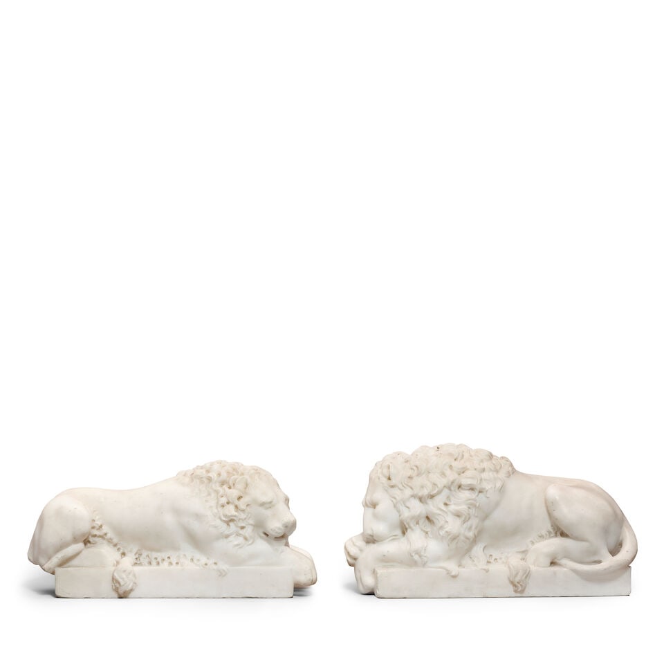 After Antonio Canova (Italian, 1757-1822): A pair of late 19th century Italian carved marble mod...: After Antonio Canova (Italian, 1757-1822): A pair of late 19th century Italian carved marble models of recumbent lions On integral rectangular bases, 31.5cm wide, 17cm high, 11cm deep For further