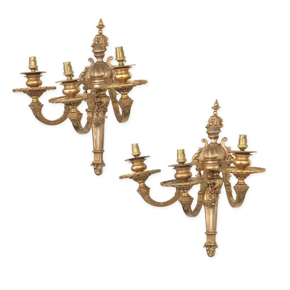 A pair of late 19th/early 20th century French three-light gilt bronze wall appliques In the Loui... - 2