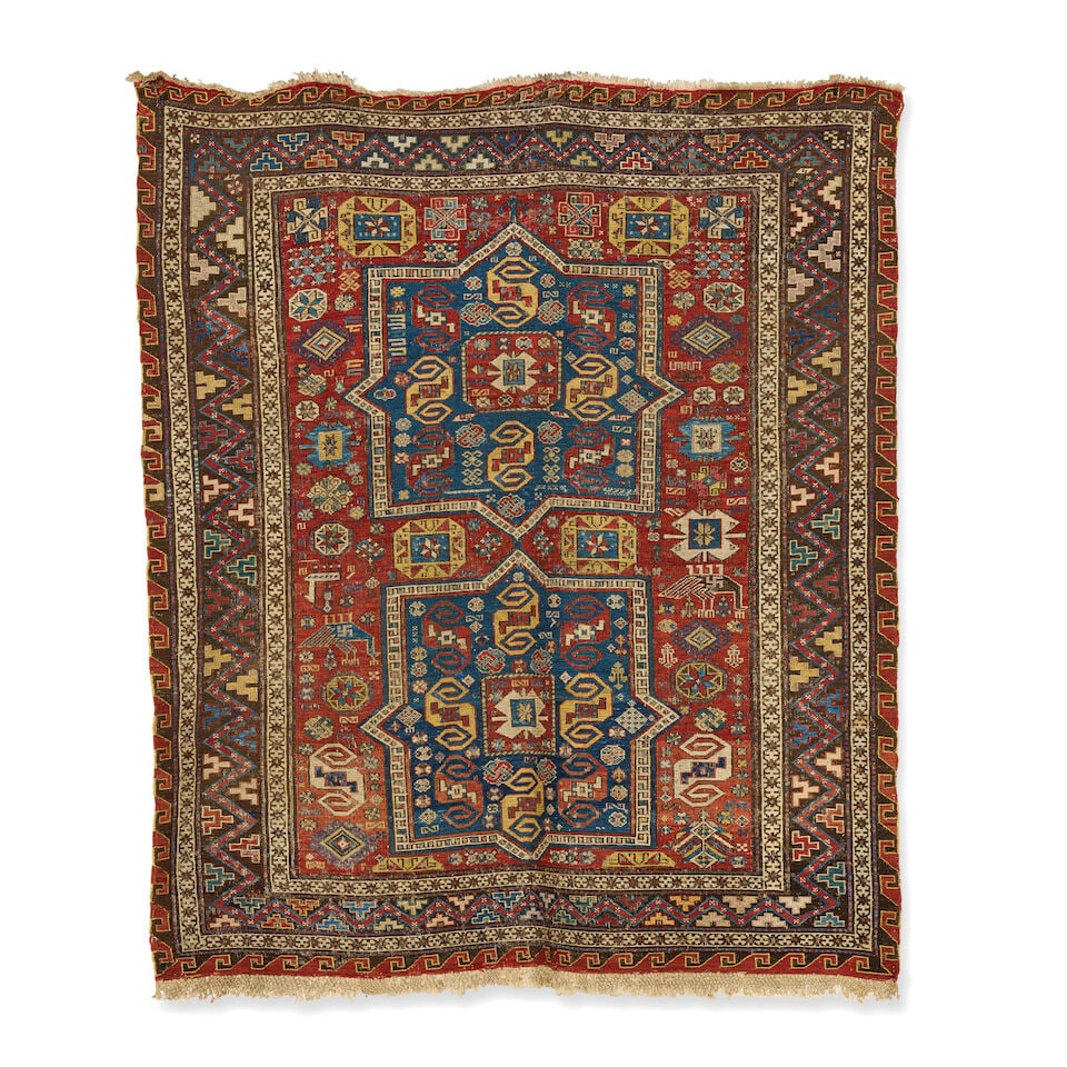 A 'pinwheel' Soumak rug Late 19th century, South Caucasus 168cm x 135cm: A 'pinwheel' Soumak rug Late 19th century, South Caucasus The madder central field with double 'pinwheel' medallions, 168cm x 135cm For further information on this lot please visit Bonhams.com For