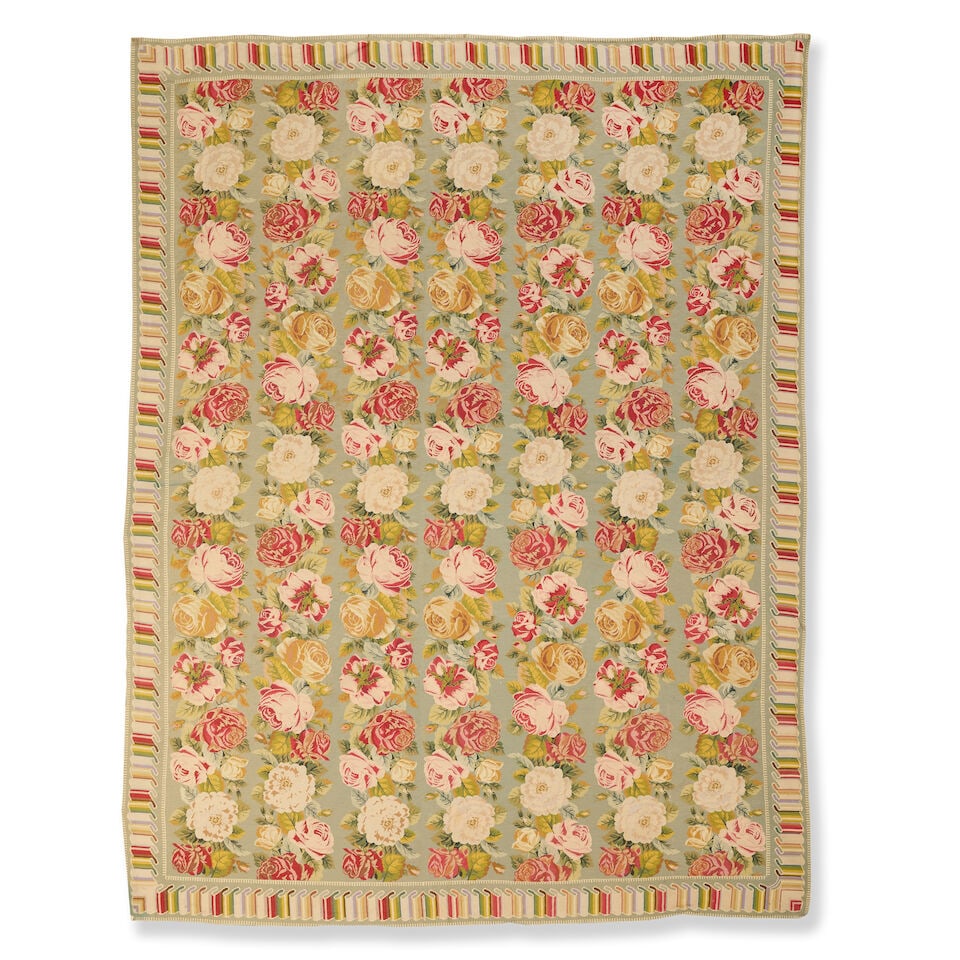 A mid-20th century French needlepoint carpet In the Aubusson style, 280cm × 350cm approx: A mid-20th century French needlepoint carpet In the Aubusson style, Designed with rows of roses enclosed by a rolling folded ribbon border, not backed, 280cm × 350cm approx This lot is subject