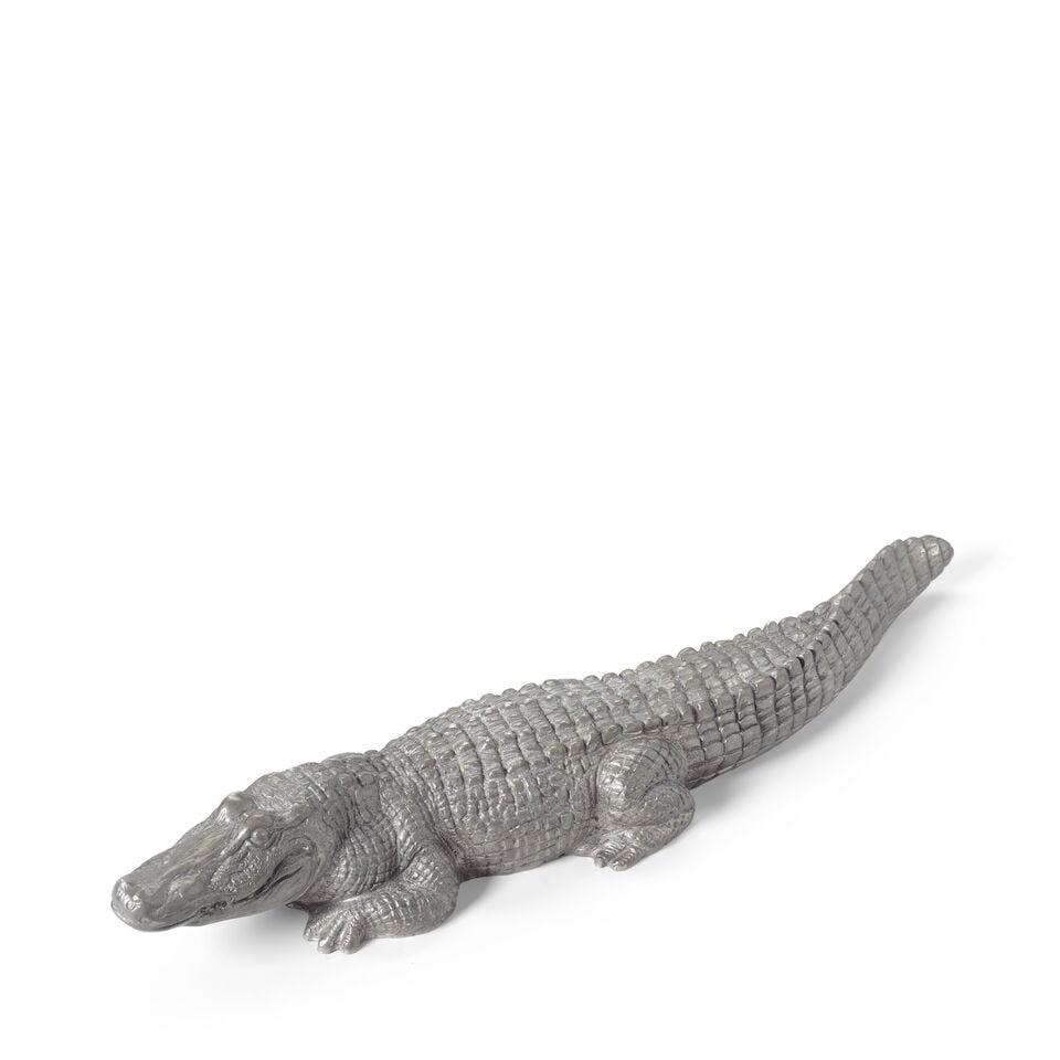 A Piero Figura pewter model of an alligator: A Piero Figura pewter model of an alligator Modelled naturalistically, the beast squat with clenched jaw, stamped on the underside Piero Figura PER ATENA ETAIN 95%, 65cm length, 14cm wide, 10cm