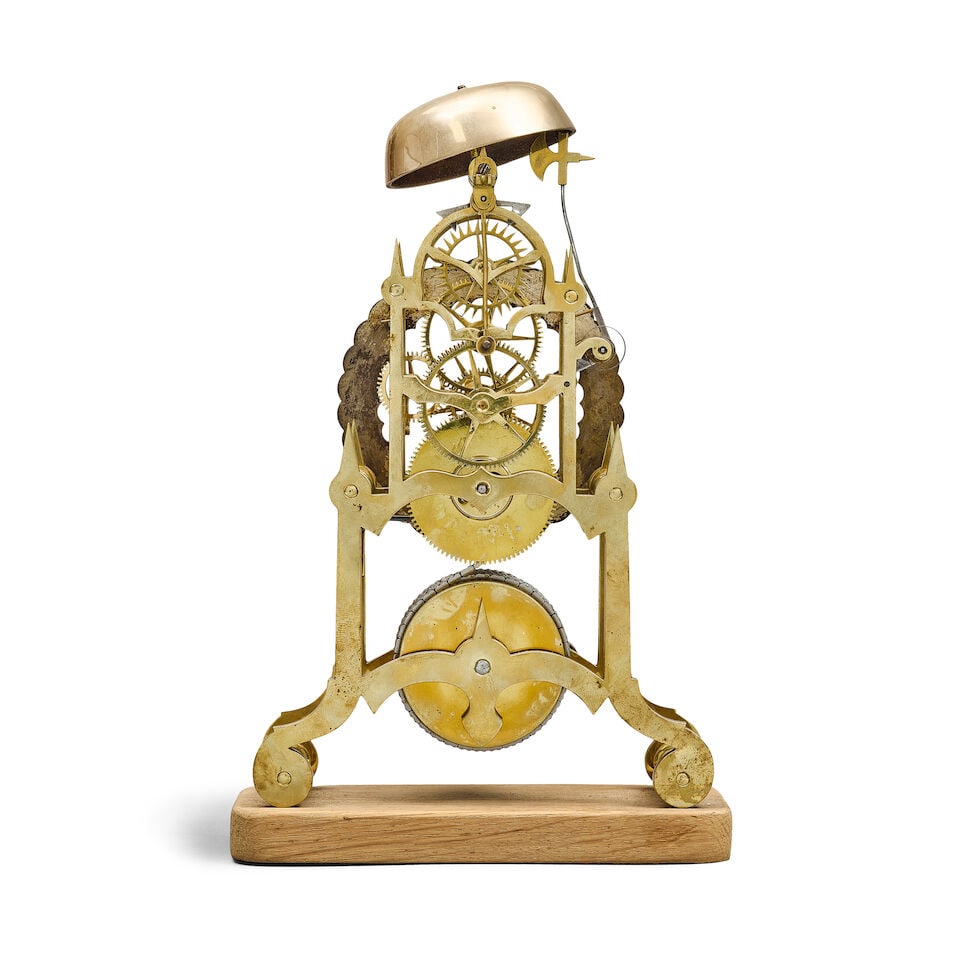 A mahogany wall clock together with an ebonised table clock, a small brass skeleton timepiece wi... - 5