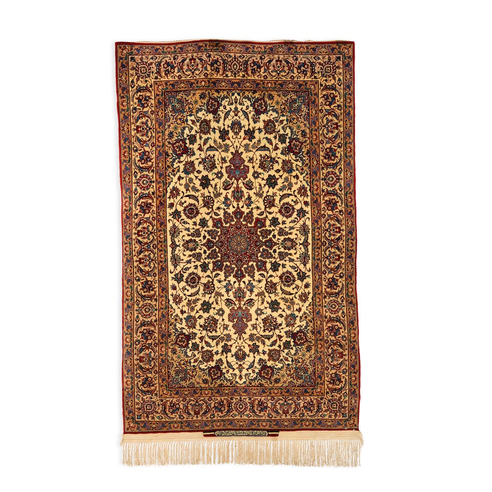 A Seirafian signed and part silk Isfahan rug 180cm x 108cm approx: A Seirafian signed and part silk Isfahan rug Signed Weave of Iran-Isfahan-Sairafian 180cm x 108cm approx Footnotes: Please note that this lot is subject to the US embargo on the import of carpets of