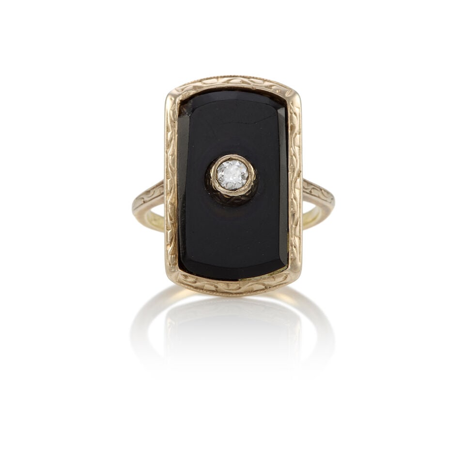 ART DECO 13K YELLOW GOLD, ONYX AND DIAMOND RING: ART DECO 13K YELLOW GOLD, ONYX AND DIAMOND RING • A round shaped diamond weighing approximately 0.07 carat • A rectangular onyx tablet measuring approximately 17.00mm x 9.77mm •