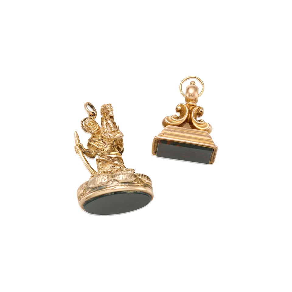 AN ANTIQUE GROUP OF GOLD AND BLOODSTONE CHALCEDONY FOBS: AN ANTIQUE GROUP OF GOLD AND BLOODSTONE CHALCEDONY FOBS • One 9K gold human figure fob with oval tablet bloodstone measuring 21.37mm x 17.42mm, measures 1 1/2 in. x 1/2 in. • One 9K gold