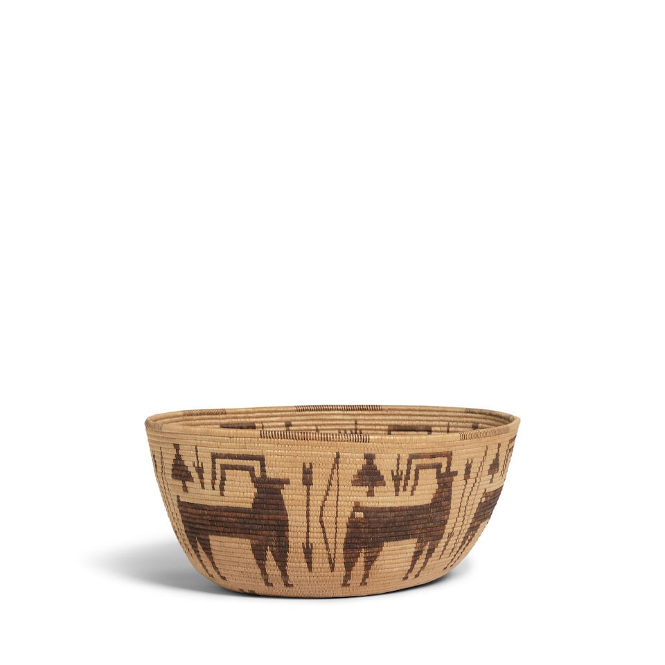 A Panamint Shoshone (Timbisha) oval pictorial basket: A Panamint Shoshone (Timbisha) oval pictorial basket Very finely woven, with bighorn sheep or whitetail deer flanked by bows and arrows, arrowheads and other devices. dimensions 8 5/8 x 7 3/8 x 3 1/2i