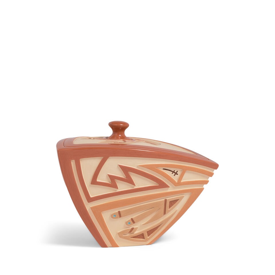 An Al Qöyawayma carved triangular lidded redware pottery vessel, 2010: Al Qöyawayma Hopi-Tewa, (b. 1938), a carved triangular tapered lidded redware pottery vessel, the two longest sides with interconnected linear and avian motifs, the back panel with Kokopelli and 