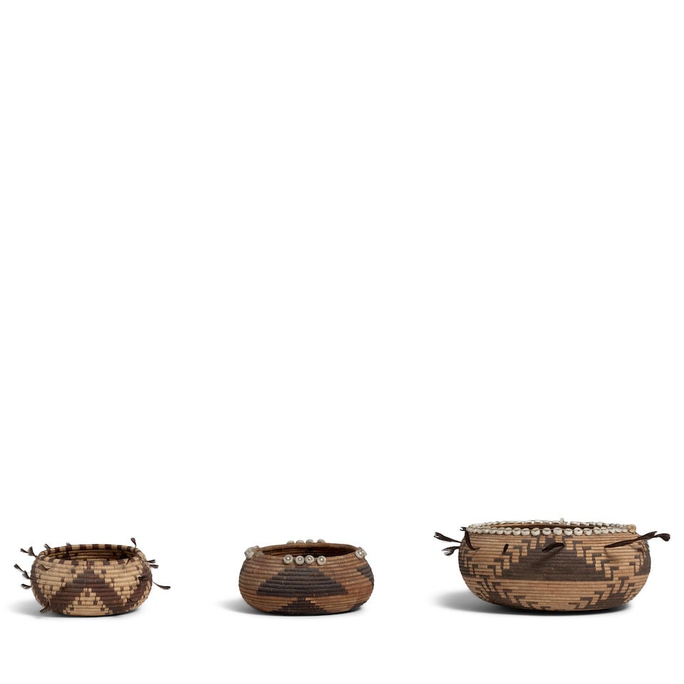 Three Pomo gift baskets: Three Pomo gift baskets The smallest finely woven with fringed zigzag design, a five-pointed star at the base, quail topknots; another example with stacked triangle design, clusters of disc beads
