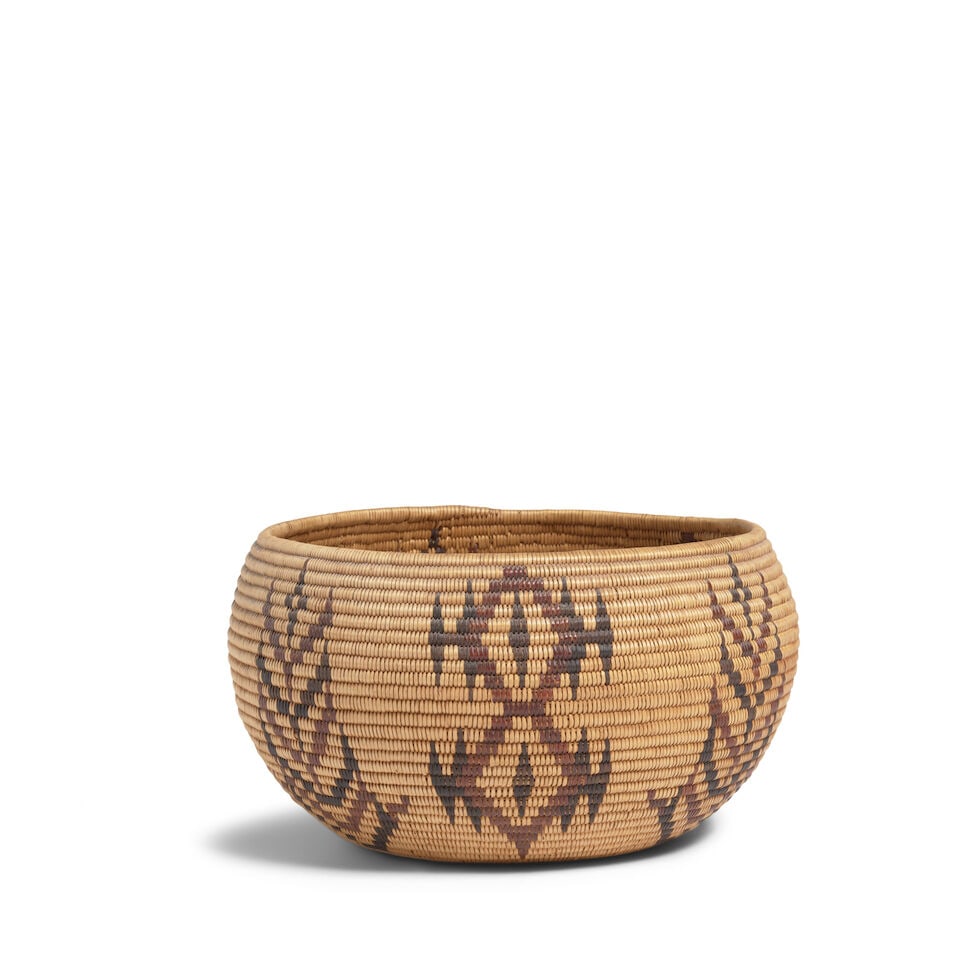 A Washoe polychrome basket: A Washoe polychrome basket Alternating stacked chevron columns and double-diamond lozenges with cats-eye centers diameter 8 3/4in, height 5in Footnotes: Provenance A Private Midwest Collection For
