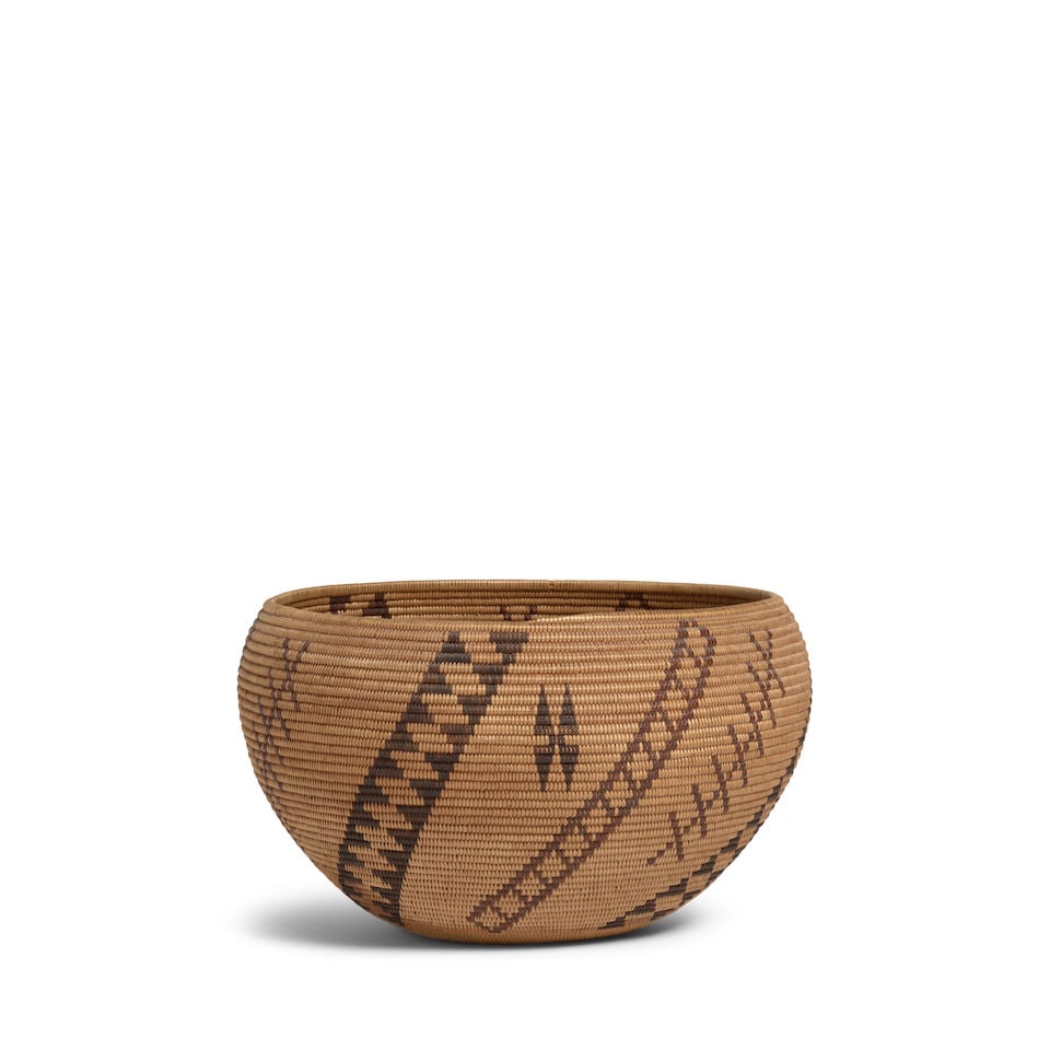 A Tillie Snooks, Washoe polychrome basket: Tillie Snooks Washoe, (c.1874-1945), a polychrome degikup basket, alternating diagonal stacked diamond and parallelogram columns, conjoined X-forms and star motifs as filler devices. diameter 12in,