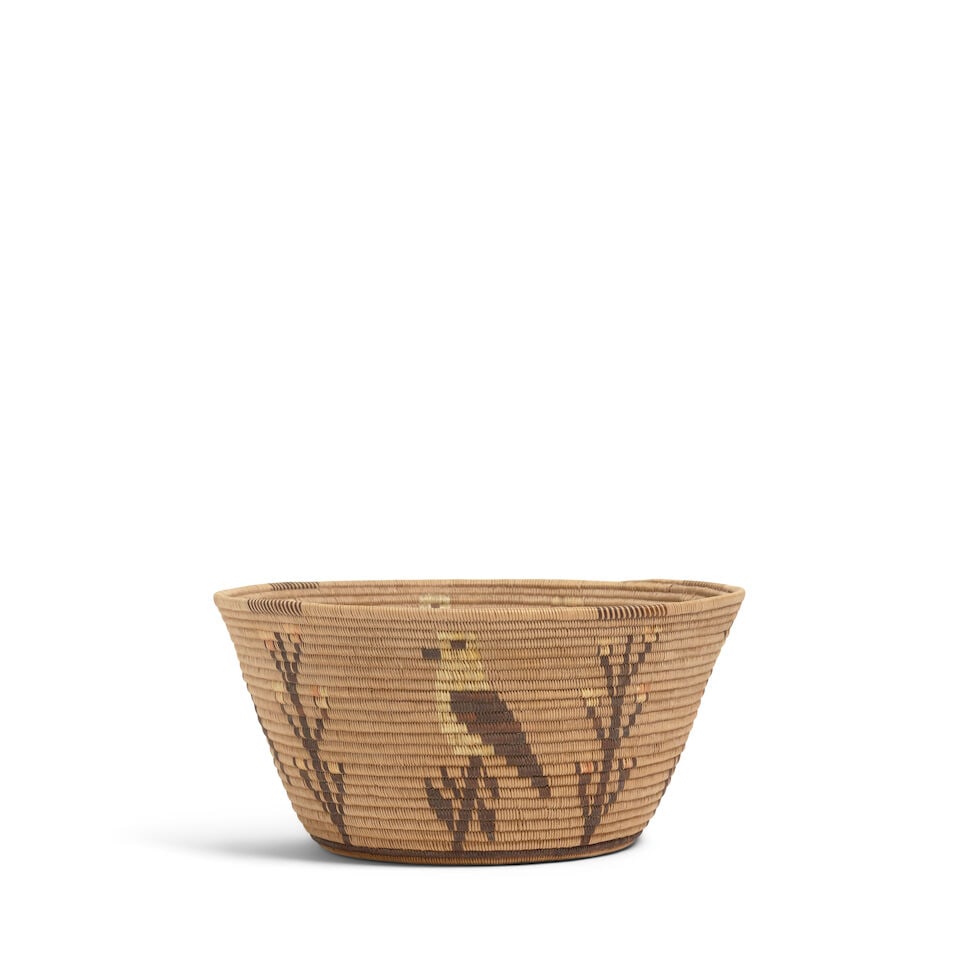 A Panamint Shoshone (Timbisha) polychrome pictorial basket, attributed to Mary Wrinkle: A Panamint Shoshone (Timbisha) polychrome pictorial basket Attributed to Mary Wrinkle, (1876-1940), finely woven with an array of birds perched on branches, flanked by flowering plants, a diamond band