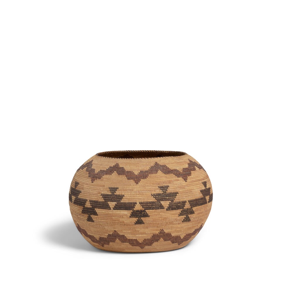 A Yokuts polychrome oval basket: A Yokuts polychrome oval basket Of rotund form, woven with alternating bands of stepped or serrated zigzags. dimensions 11 3/4 x 10 x 7 1/2in Footnotes: Provenance Kania-Ferrin Gallery, Santa Fe,