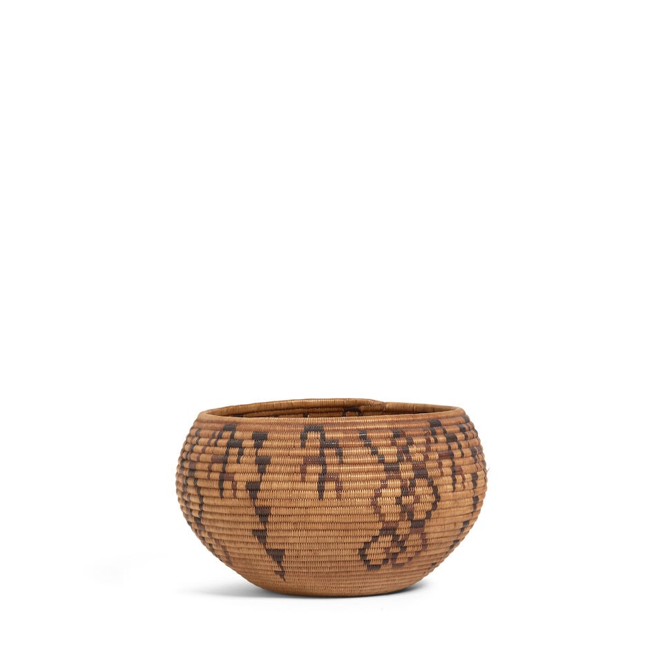 A Washoe polychrome basket, possibly the work of Jennie Bryant Shaw: A Washoe polychrome basket Possibly the work of Jennie Bryant Shaw, (c. 1874-1954), of degikup form, alternating leafy stalk and floriforms with stacked triangle meanders. diameter 8 1/2in, height 4 3