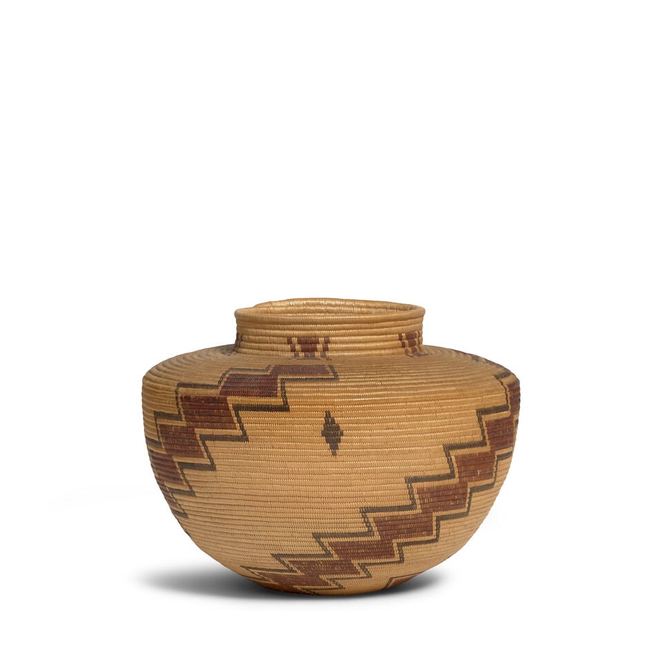 A Kawaiisu polychrome bottleneck basket: A Kawaiisu polychrome bottleneck basket Three stepped diagonal columns rising from the base to the collar, hourglass motifs at the neck. diameter 8in, height 6 3/8in Footnotes: Provenance ex-Gottlieb