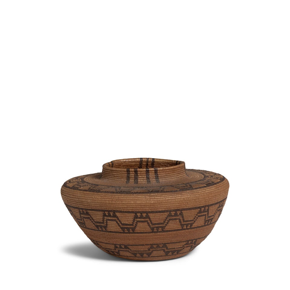 A Kawaiisu bottleneck basket: A Kawaiisu bottleneck basket Woven with three bands of stepped meanders, also known as the 'flight of the butterfly' design. diameter 10 1/4in, height 5 5/8in Footnotes: Provenance Transitional Arts,