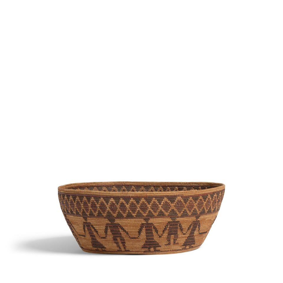 A Sally Edd, Yokuts polychrome oval Friendship basket: Sally Edd Yokuts, (1892-1987), a polychrome oval Friendship basket, alternating male and female figures encircling the bowl, a rattlesnake band below the rim. dimensions 12 1/4 x 10 1/2 x 4