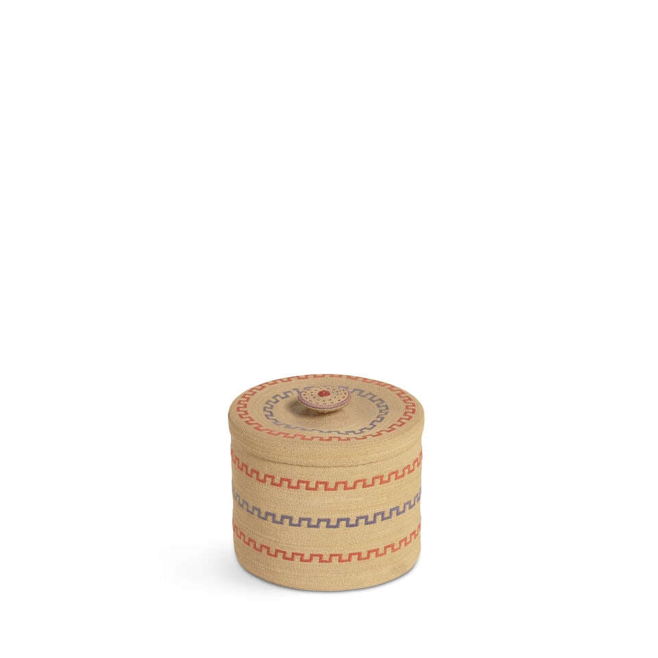 An Attu polychrome lidded basket: An Attu polychrome lidded basket Very finely woven, embroidered in a series of concentric crenelated bands alternating in colors, the finial with stripes and dotted pattern. diameter 4in, height 3 5/8
