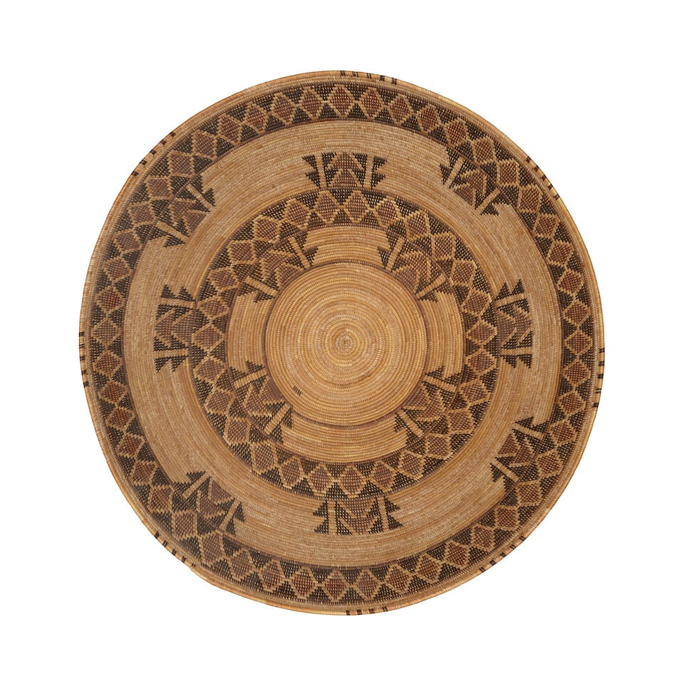 A Yokuts polychrome basket: A Yokuts polychrome basket Twin rattlesnake bands encircling the body, similar motifs accentuating the rings. diameter 16in, height 6in Footnotes: Provenance ex-Gottlieb A. Steiner Collection,