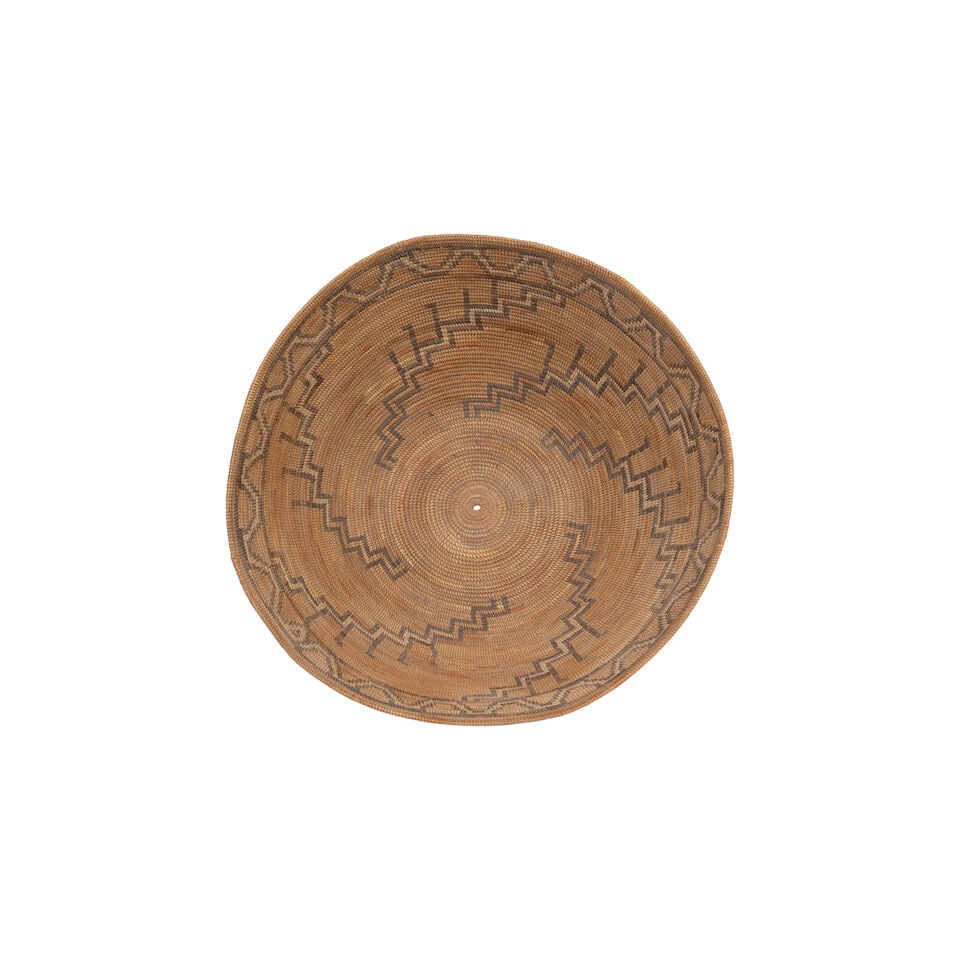 A Chumash polychrome basket: A Chumash polychrome basket Stepped diagonals radiating up the body, a fretwork band about the rim, areas of restoration. diameter 11 3/4in, height 5in Footnotes: Provenance Kania-Ferrin Gallery,