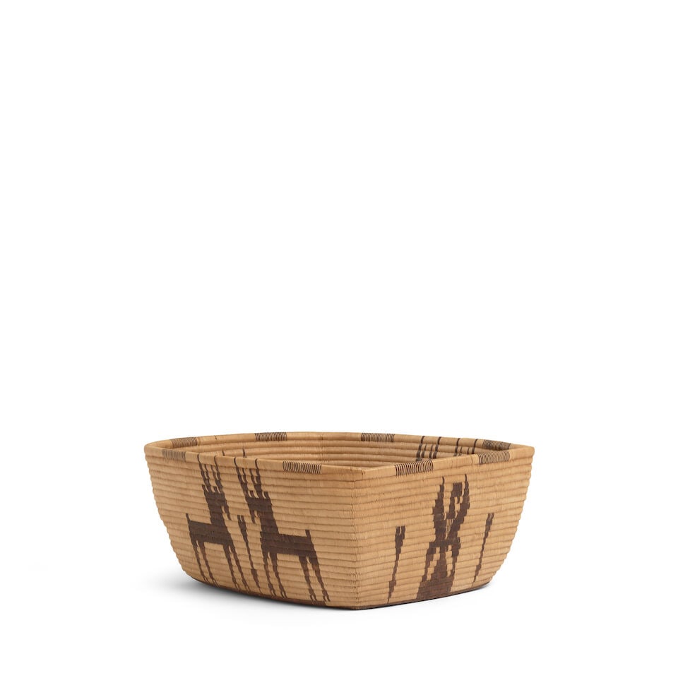 A Panamint Shoshone (Timbisha) rectangular pictorial basket: A Panamint Shoshone (Timbisha) rectangular pictorial basket Very finely woven, aligning opposing pronghorn across the length, solitary Federal eagles centered at the breadth, arrow motifs as accents,