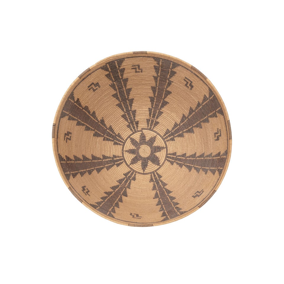 A Panamint Shoshone (Timbisha) polychrome basket: A Panamint Shoshone (Timbisha) polychrome basket Columns of stacked serrates ascending the bowl, fretwork accents in the open fields, an eight-pointed star at the base. diameter 11 1/8in, height 5