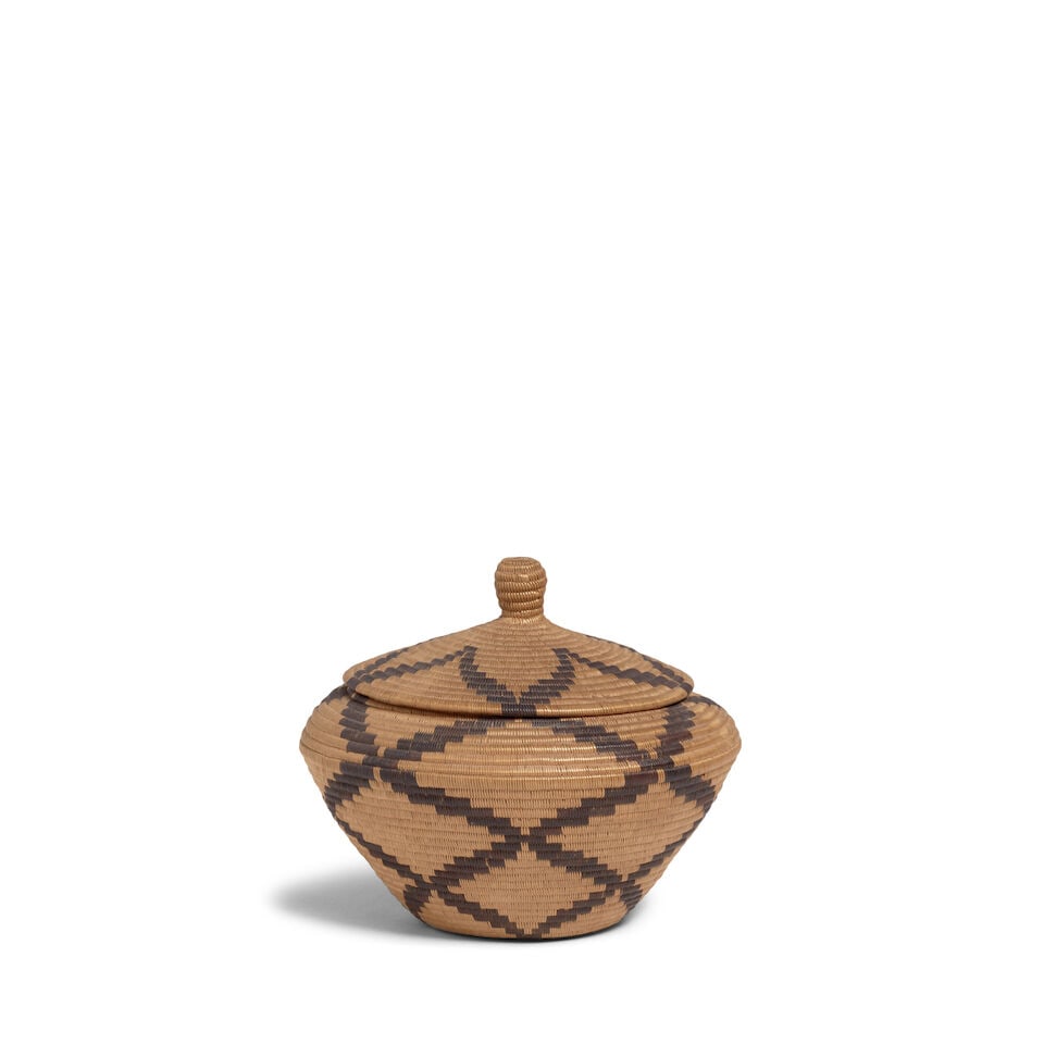 A Panamint Shoshone (Timbisha) lidded basket: A Panamint Shoshone (Timbisha) lidded basket The lid centering a five-point star, the body with diamond latticework design emergent from a similar star at the base. diameter 6 7/8in, height 5 3/4in Fo