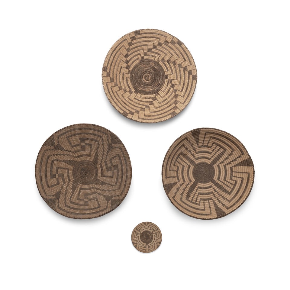 Four Akimel O'odham (Pima) petite trays: Four Akimel O'odham (Pima) petite trays Two worked in four-armed fretwork designs, another with a pinwheel effect, the smallest with a three-point motif. diameter 8 1/2 - 2