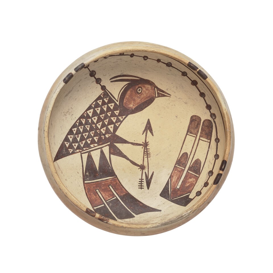 A Hopi polychrome pictorial bowl, attributed to Nampeyo: A Hopi polychrome pictorial bowl Attributed to Nampeyo, Hopi-Tewa, (1859-1942), a bird clutching arrows linked by a dotted line to a double feather motif. diameter 9 1/4in, height 3