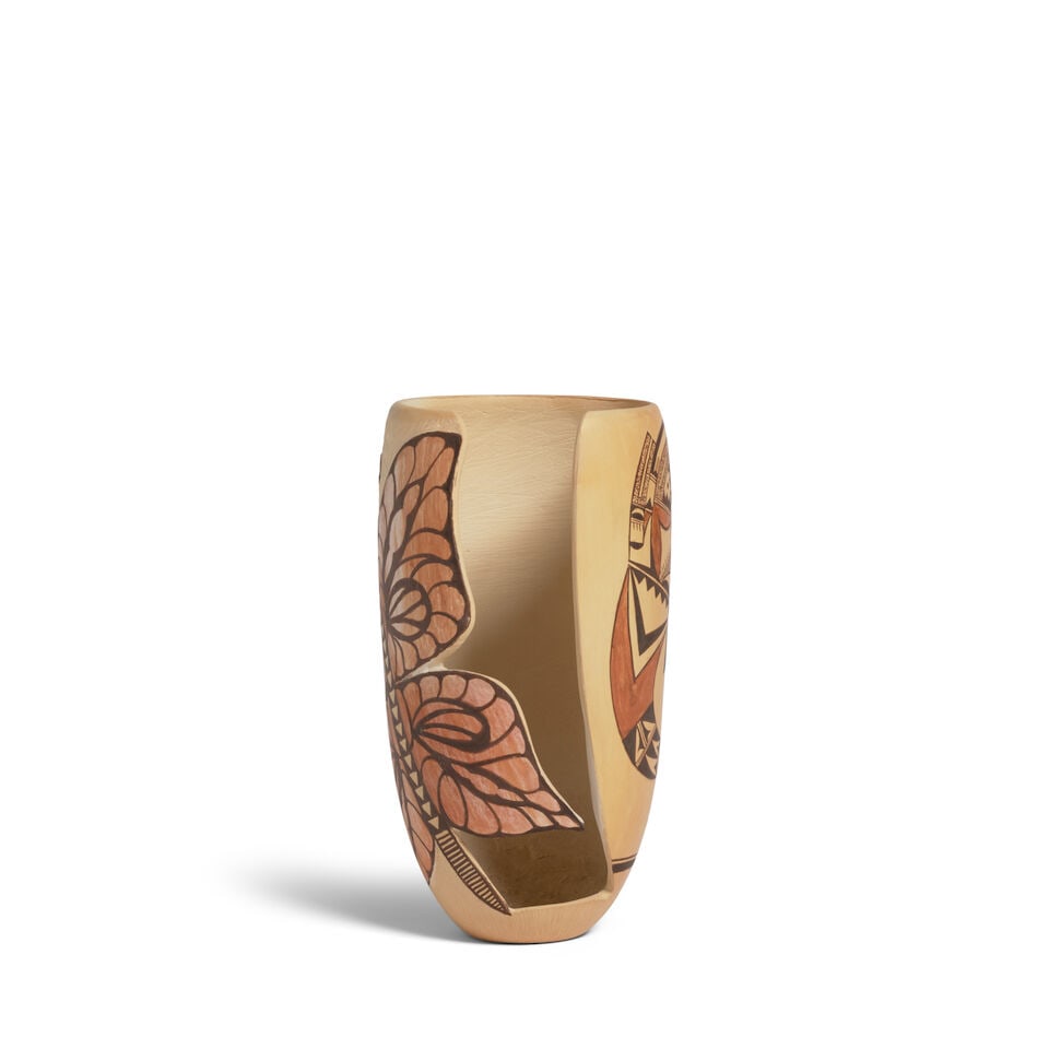 A Dextra Quotskuyva Nampeyo polychrome carved and sgraffito vase: Dextra Quotskuyva Nampeyo Hopi-Tewa, (1928-2019), a polychrome vase, one side with a butterfly extending the length of the vessel, one side cut way to reveal the interior, a register with stylized