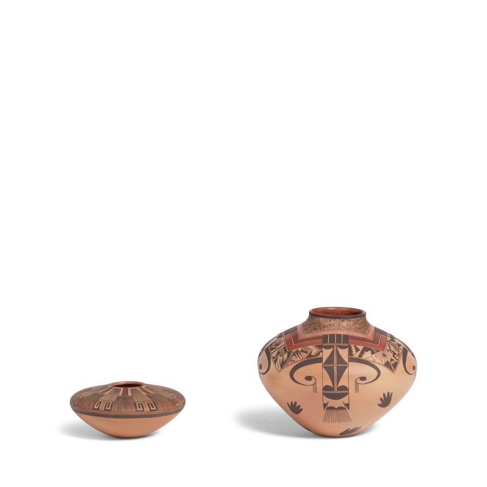 Two Jacob Koopee polychrome jars: Jacob Koopee Hopi-Tewa, (1970-2011), two polychrome vessels, the smaller seed jar with 8-pointed fine linear design radiating from the mouth and terminating in hooked motifs; the larger example with