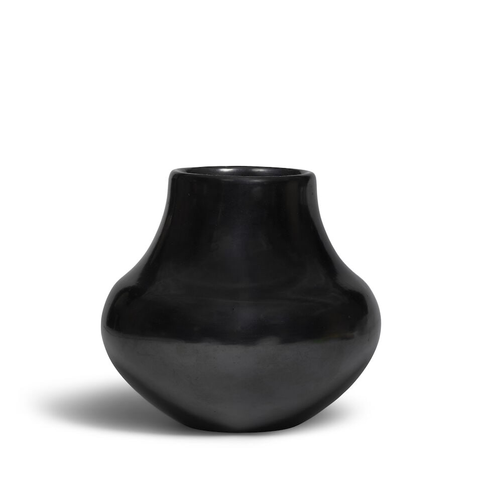 A Maria Martinez blackware jar: Maria Martinez San Ildefonso, (1887-1980), a blackware jar, the unpainted vessel polished to a high luster finish, signed 'Maria Pove'ka.' diameter 7 1/2in, height 6 7/8in Footnotes: Provenance A
