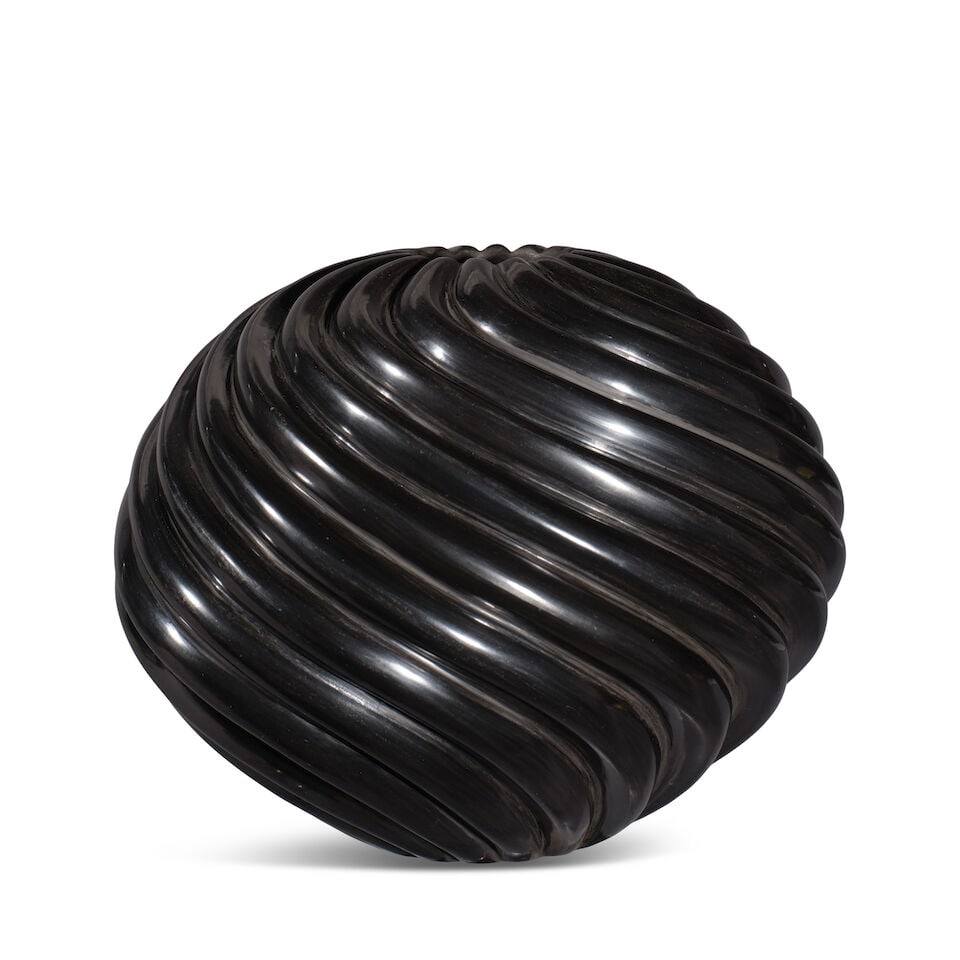 A Nancy Youngblood blackware melon jar: Nancy Youngblood Santa Clara, (b. 1955), 2006, a spiral blackware melon jar with 16 ribs, signed and dated at the base. diameter 6 1/4in, height 5 1/4in Footnotes: Provenance Grimmer Roche, Santa Fe,