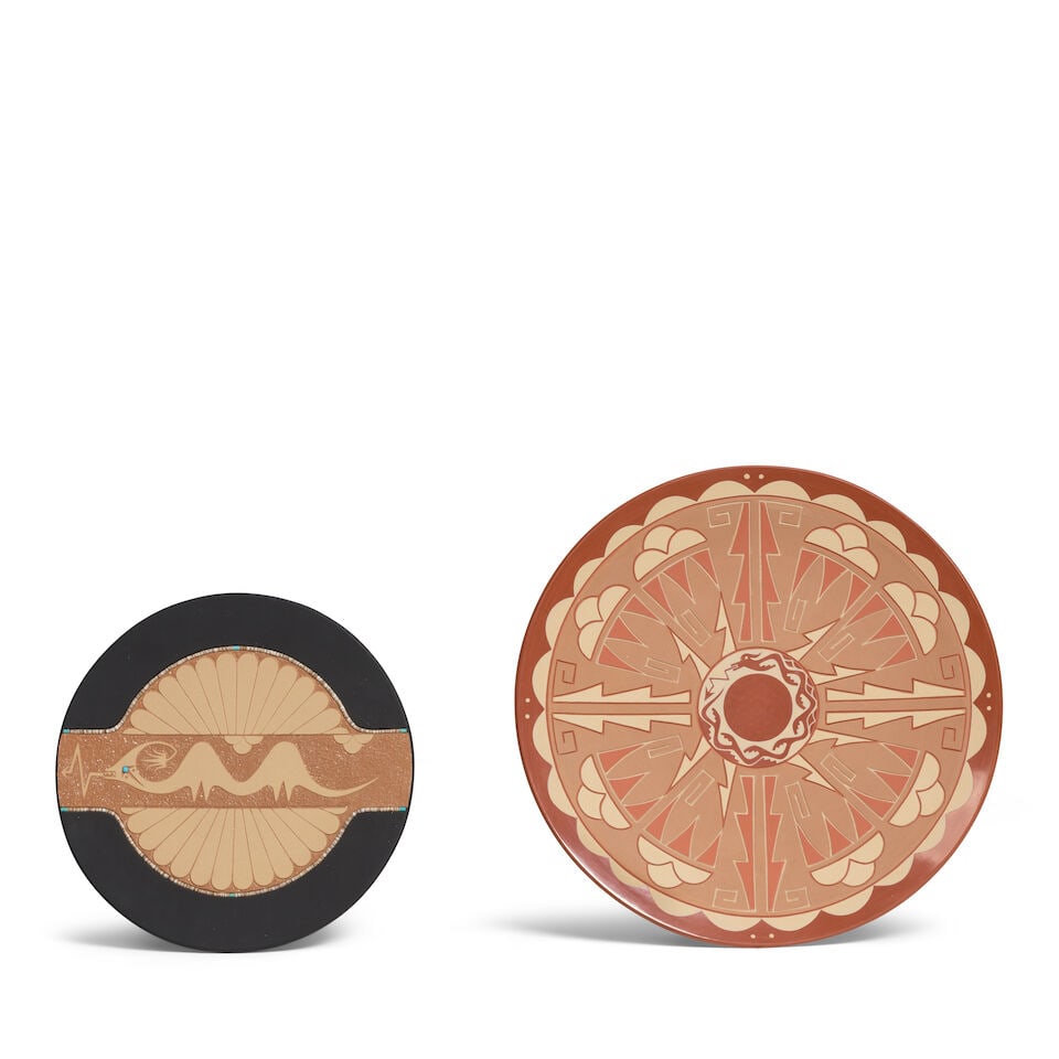 Two Pueblo pottery plaques or plates: Two Pueblo pottery plaques or plates Each centering an avanyu motif, including a red and buffware example, Dolores (Santa Clara, [b. 1954]) and Alvin Curran (San Juan, [1953-1999]), signed by both