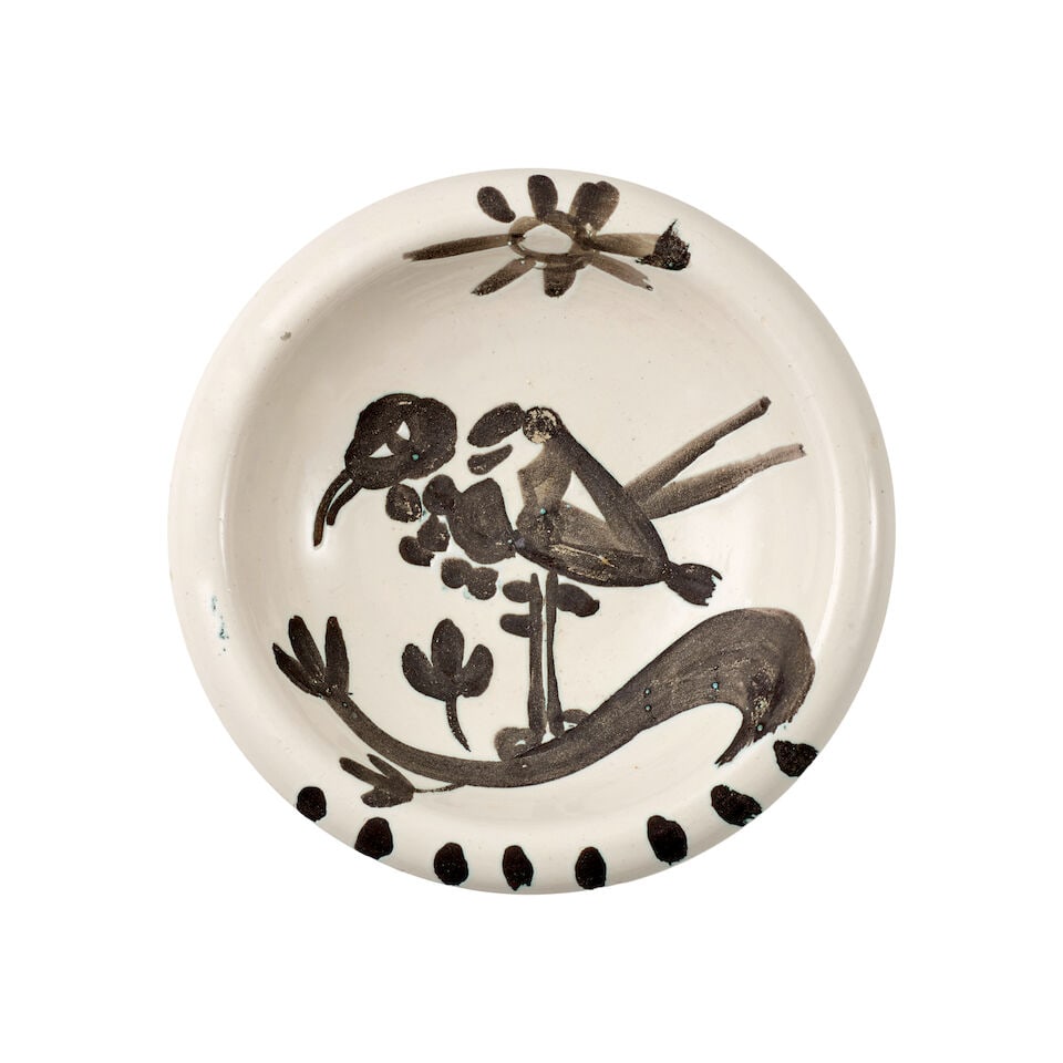 Pablo Picasso (1881-1973); Oiseau au Soleil;: Pablo Picasso (1881-1973) Oiseau au Soleil (Ramié 174), 1952 White earthenware clay turned round ashtray, with oxidize paraffin decoration and white enamel, from the edition of 500, inscribed