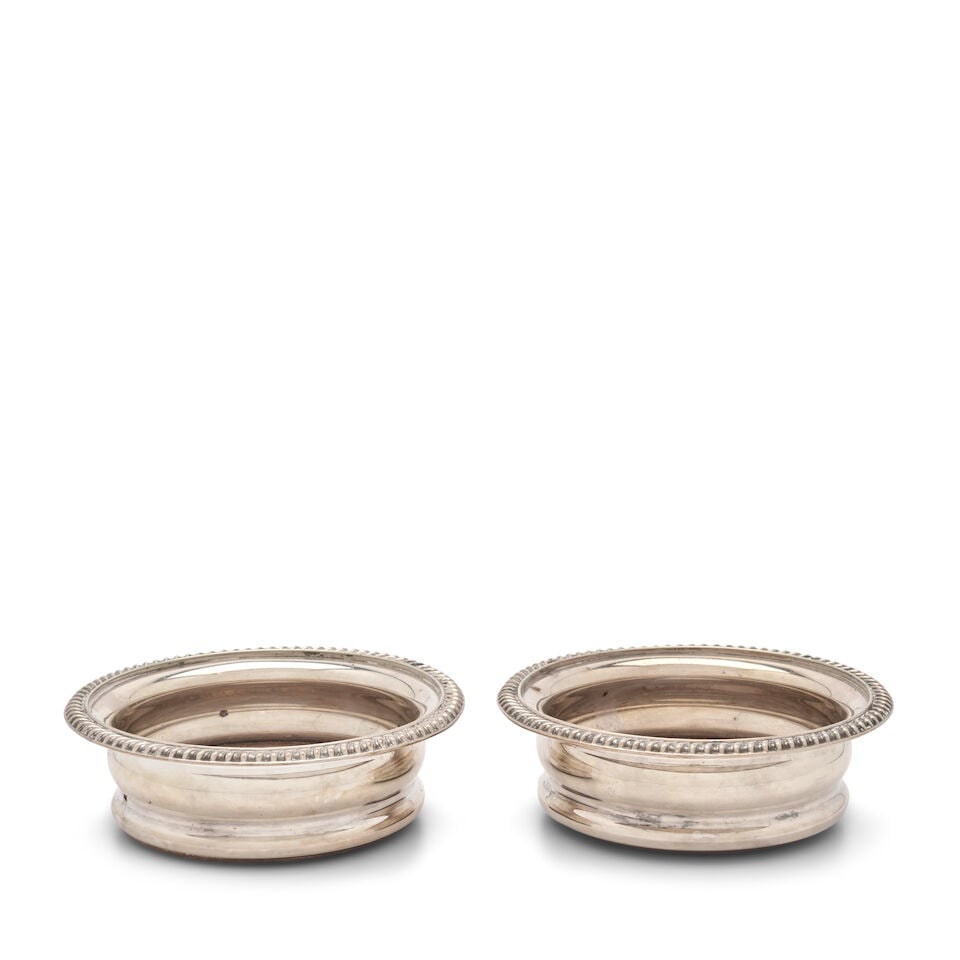 A Pair of Silverplate Wine Coasters, Barker Ellis, Birmingham, 20th century: A Pair of Silverplate Wine Coasters, Barker Ellis, Birmingham, 20th century circular, each with a gadrooned rim above a ribbed body, dia. 5 3/4 in. Lot to be sold without reserve. This lot is subject