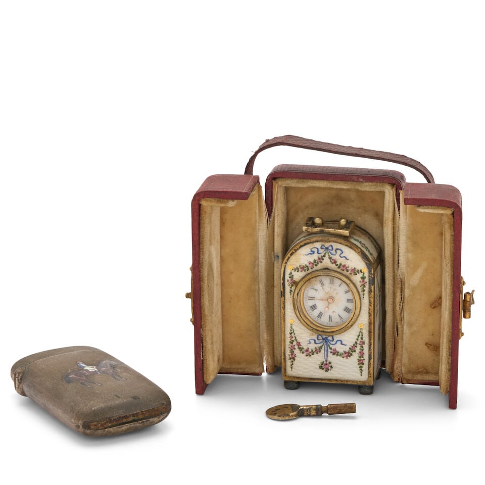 Two Pieces of Austro-Hungarian Silver, early 20th century,: Two Pieces of Austro-Hungarian Silver, early 20th century, includes a miniature .900 silver and enamel clock, ht. 2; and a .800 silver match safe with a horse and jockey, lg. 2 1/4, approx. 3 troy