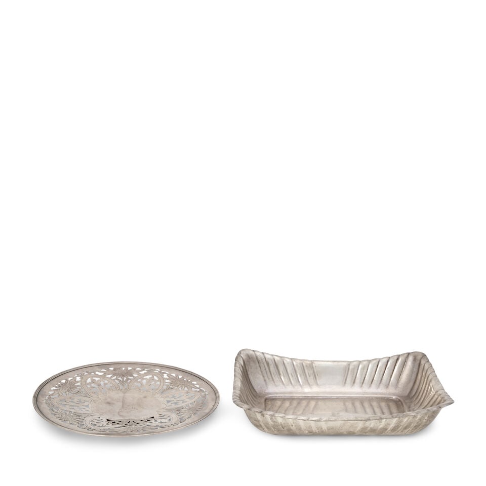 Two Pieces of American Silver,: Two Pieces of American Silver, the cake plate by Gorham, retailed by Montgomery Bros., marked for 1910, the pierced well foliate engraved, with a crest to center, dia. 9 1/2; the breadbasket by Reed