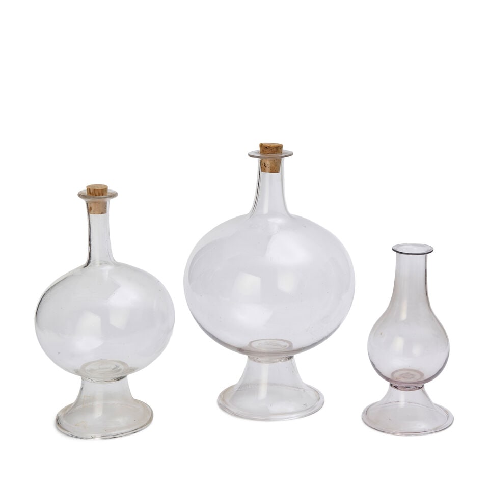 Three Blown Glass Lacemakers' Lamps, United States, 19th century: Three Blown Glass Lacemakers' Lamps, United States, 19th century lead glass, comprising two globular-form lamps with long necks and one pear-shaped lamp, ht. to 12 in. Lot to be sold without reserve. 