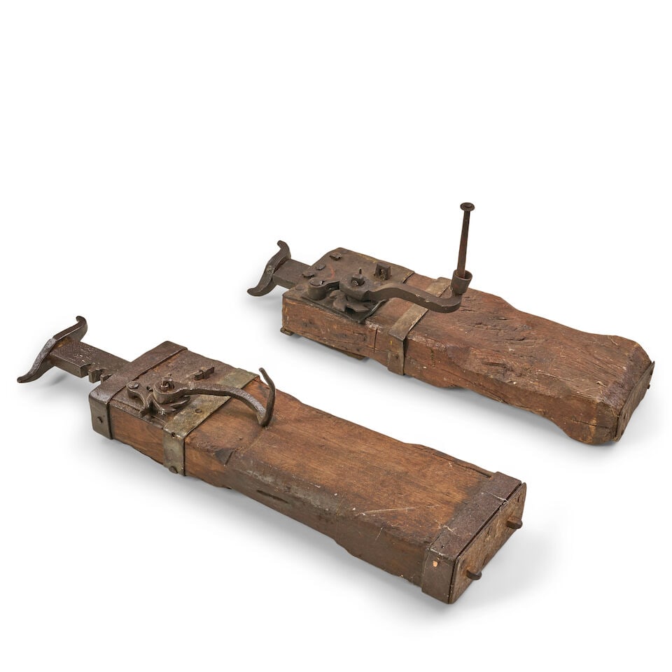 Two Dated Conestoga Wagon Jacks, United States, 1818,: Two Dated Conestoga Wagon Jacks, United States, 1818, each with a carved wood body fitted with wrought-iron bands, ratcheting mechanism, crank handle, and lifting arm, each dated '1818,' approx. lg. 2